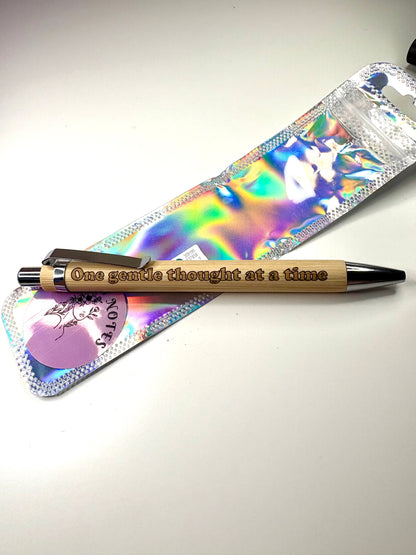 Engraved bamboo pen with "one gentle thought at a time" inscription, eco-friendly, includes refill, sustainable writing tool