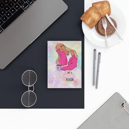 Colorful hardback journal on a desk with vibrant design, ideal for writing and sketching.