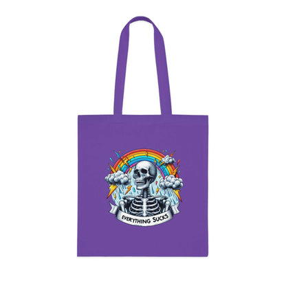 Purple cotton tote bag with "Everything Sucks" quote, featuring a skeleton and rainbow design, eco-friendly fashion.