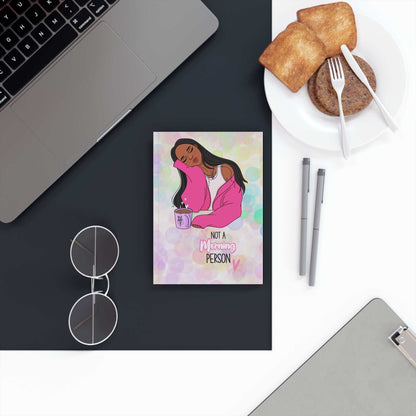 Colourful hardback journal on desk with laptop and breakfast, ideal for expressive writing.