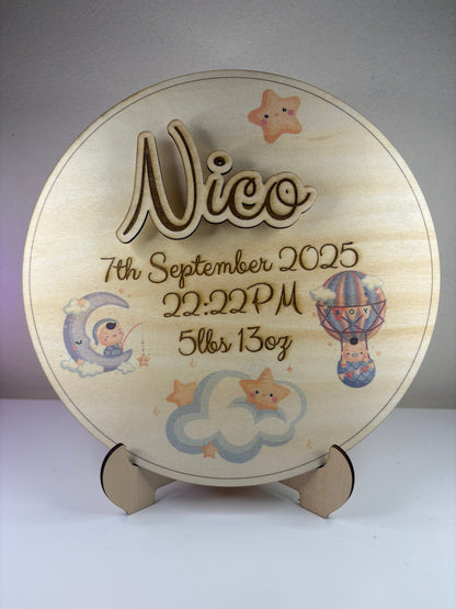 Personalised baby birth announcement plaque with 3D name, birth details, cute illustrations, and wooden stand