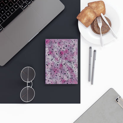 Whimsical A5 hardcover notebook with vibrant, eye-catching design on desk.