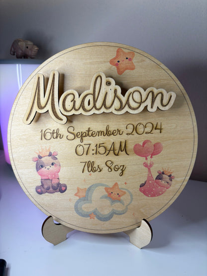 Personalised baby birth announcement plaque with 3D name, birth details, cute illustrations, and stand on eco-friendly basswood