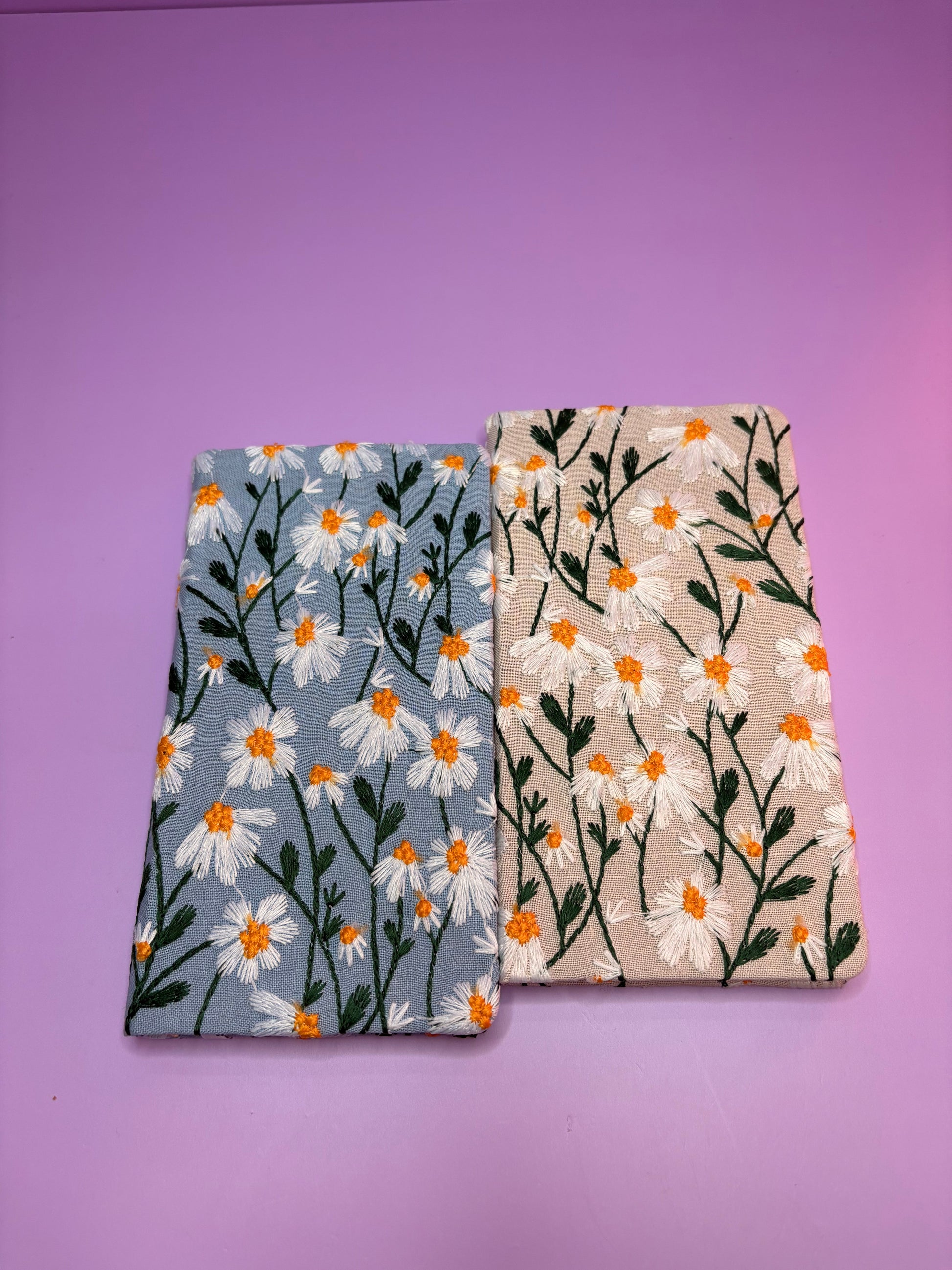 A6 embroidered daisy notebooks with hardback covers in blue and cream floral designs