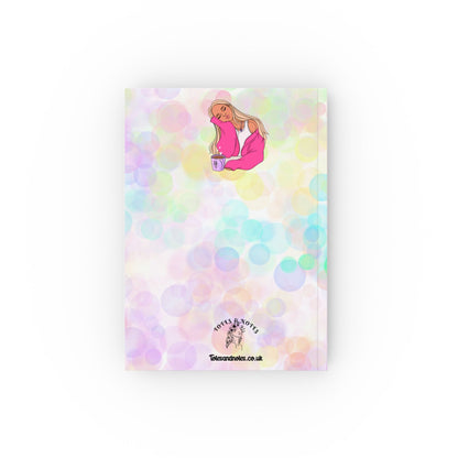 Colorful hardback notebook with vibrant design and creative illustration.