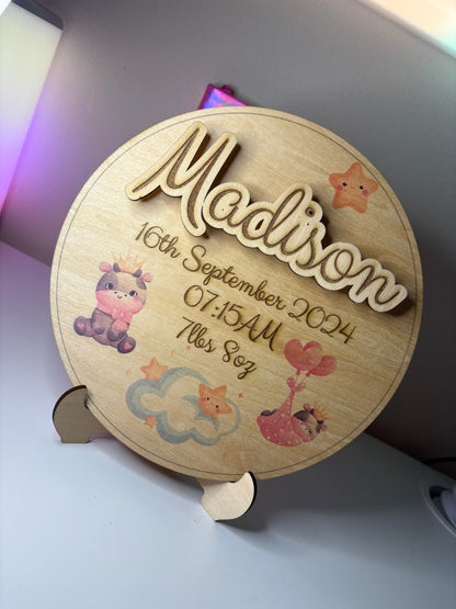 Personalised baby birth announcement plaque with 3D name, birth details, cute illustrations, and stand on basswood wood