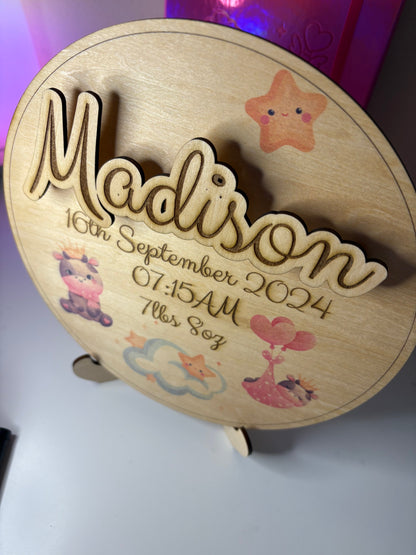 Personalised baby birth announcement plaque with 3D name, birth details, cute illustrations, and stand on eco-friendly basswood