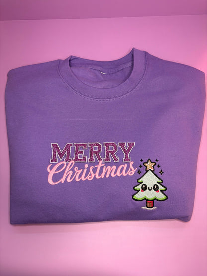 Lilac kawaii style glitter Merry Christmas jumper folded on pink background Christmas Jumper