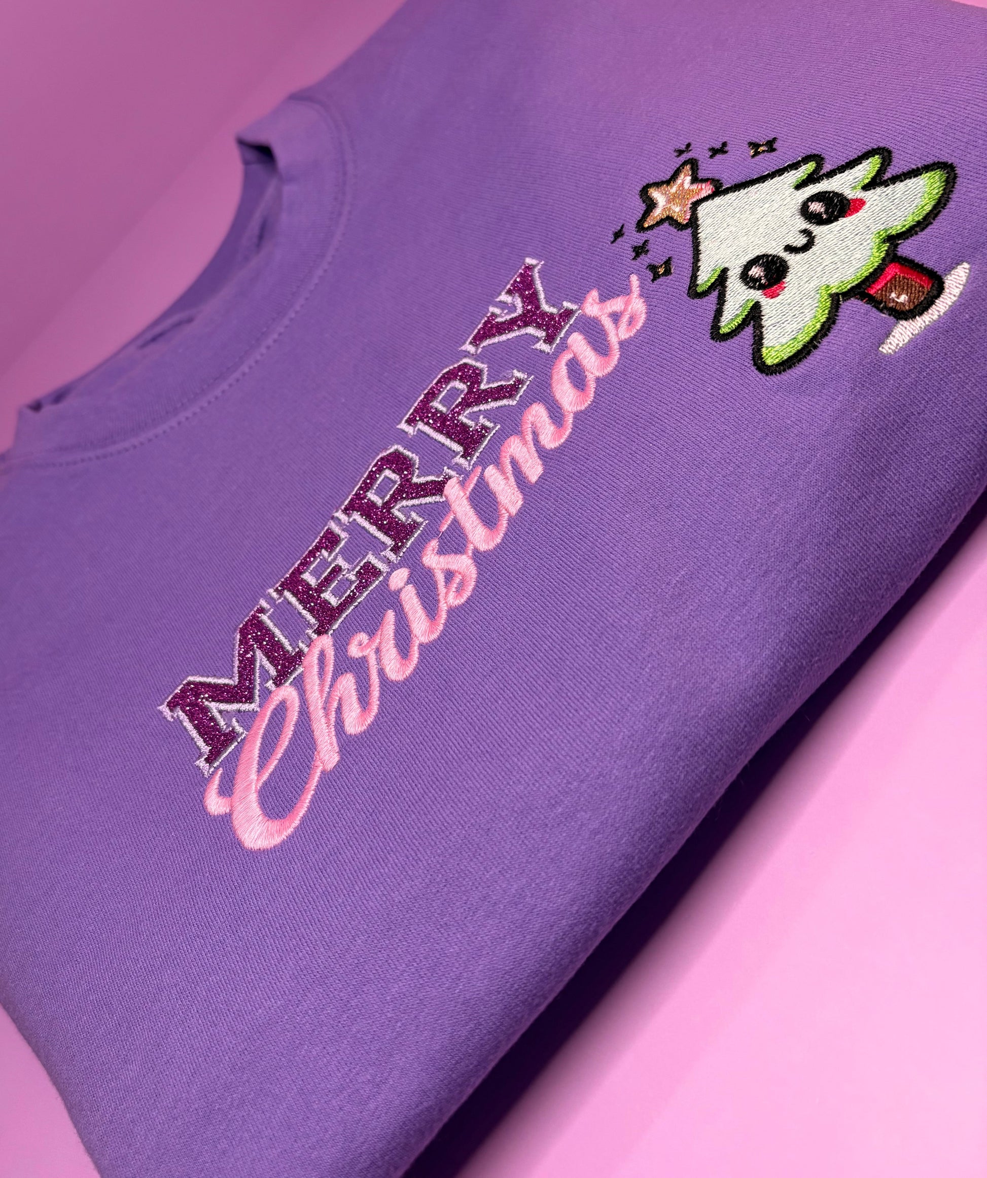 Purple kawaii Christmas jumper with glitter Merry Christmas text and cute Christmas tree design