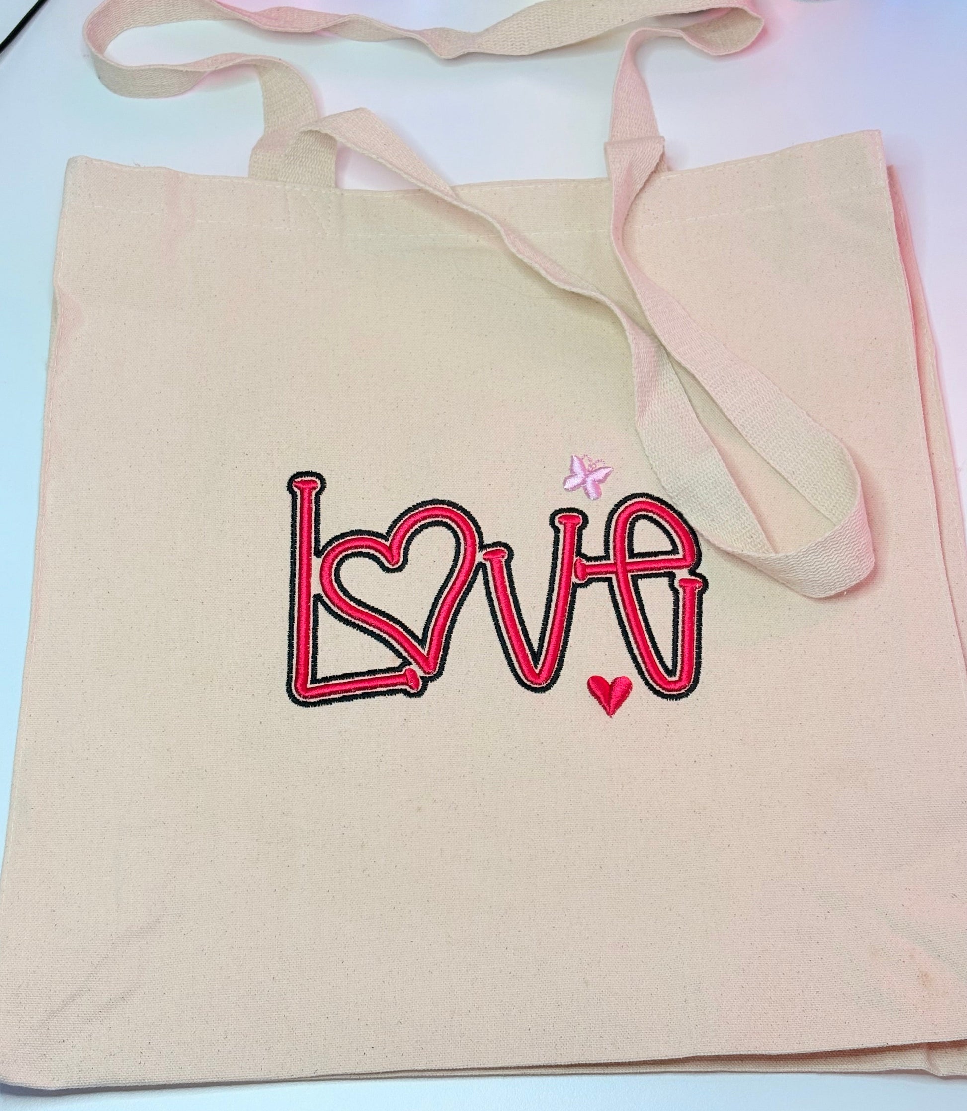 Heavy canvas tote bag with 3D puff embroidered LOVE design, long handles, 24L capacity, natural color