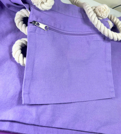 Lilac marine style tote bag with thick twisted rope handles and front zip pocket detail