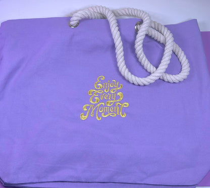 Lilac marine style tote bag with thick twisted rope handles and gold "Enjoy Every Moment" embroidery