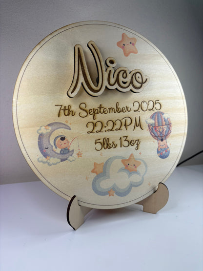Personalised baby birth announcement plaque with engraved name, birth details, 3D effect, cute illustrations, and wooden stand