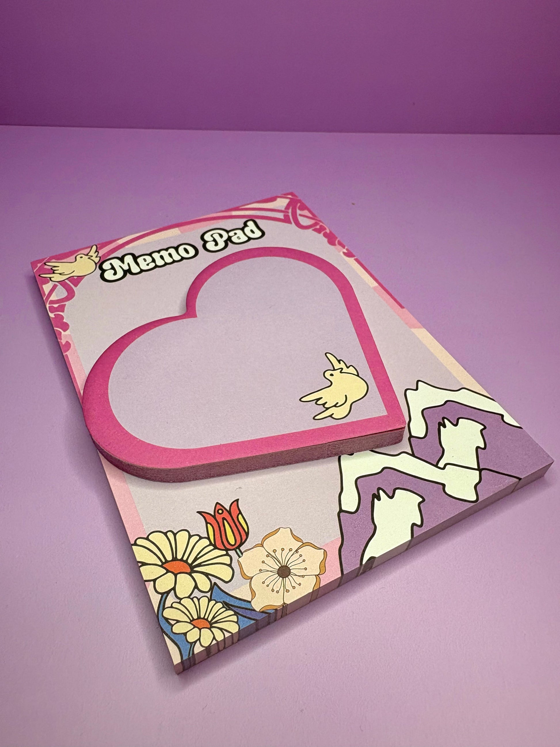 Breathe & Bloom A6 memo pad and pink heart-shaped sticky notes with retro floral design on purple background