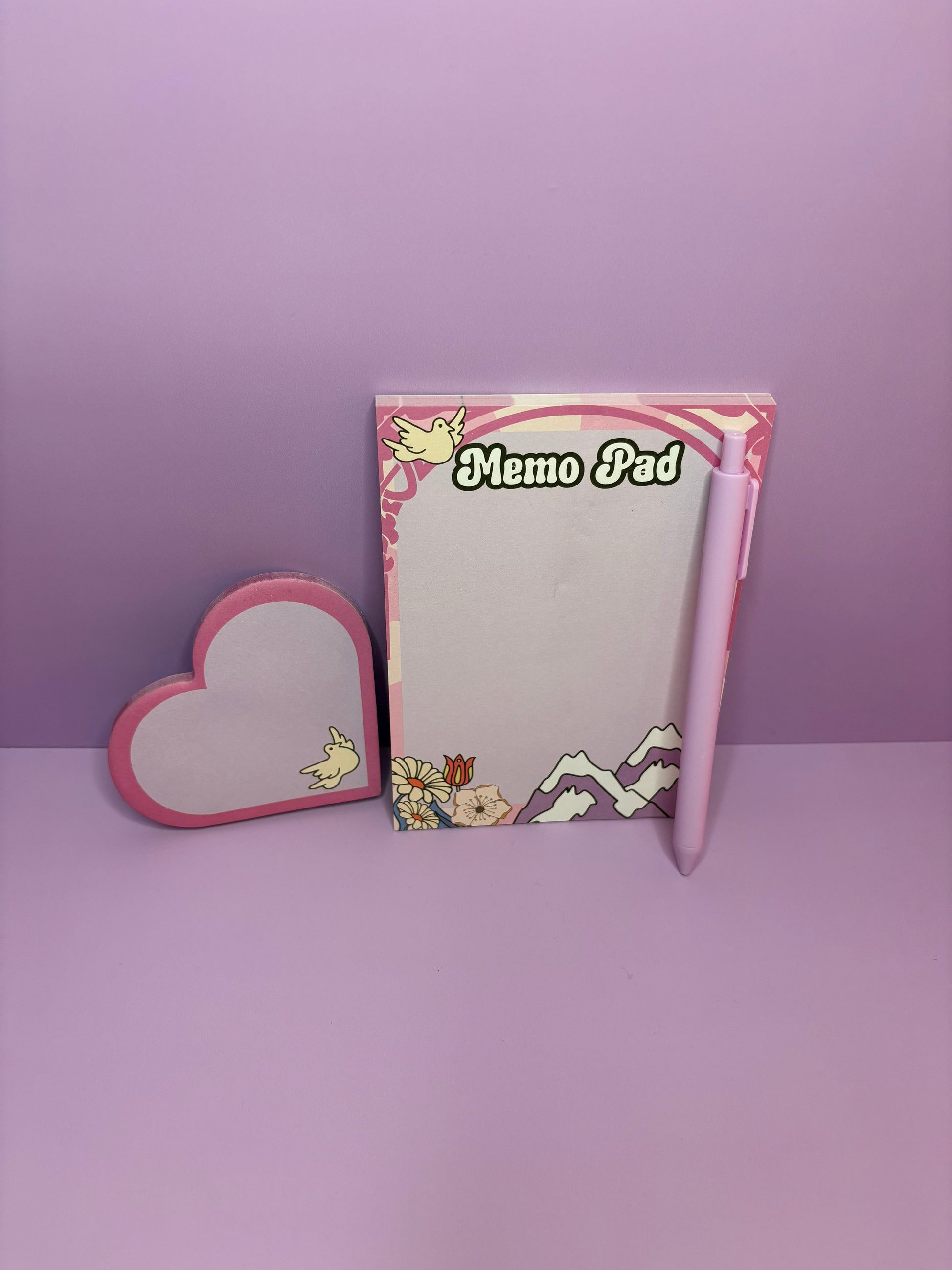 Breathe & Bloom notepad set with A6 memo pad, heart-shaped sticky notes, and pink pen on lilac background