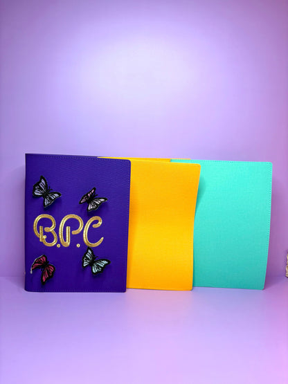 3D butterfly embroidered personalised A5 fabric notebook in purple, yellow, and aqua colors