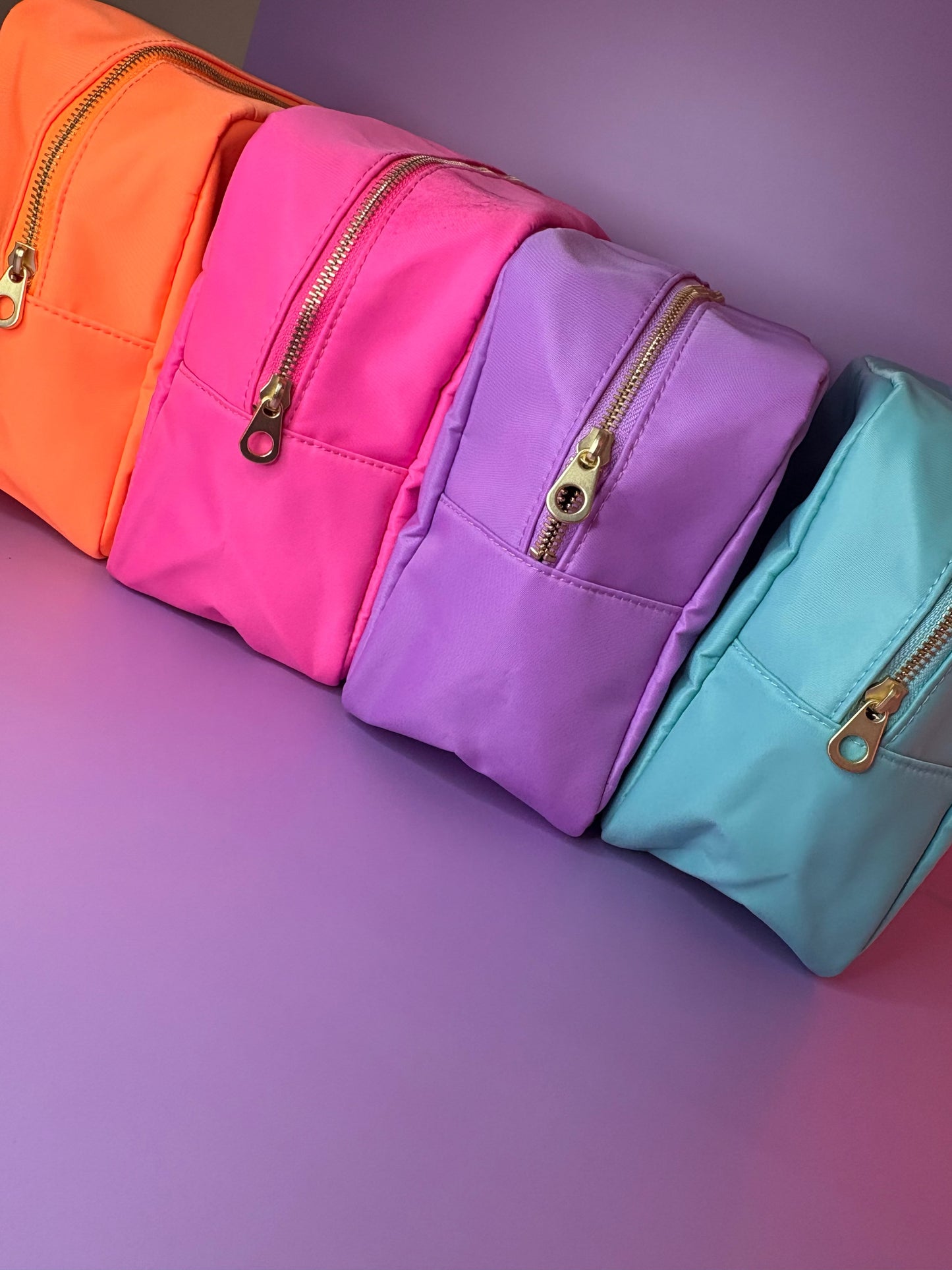 Personalised 3D puff embroidered large cosmetic bags in hot pink, lilac, mint, and orange colors with gold zippers