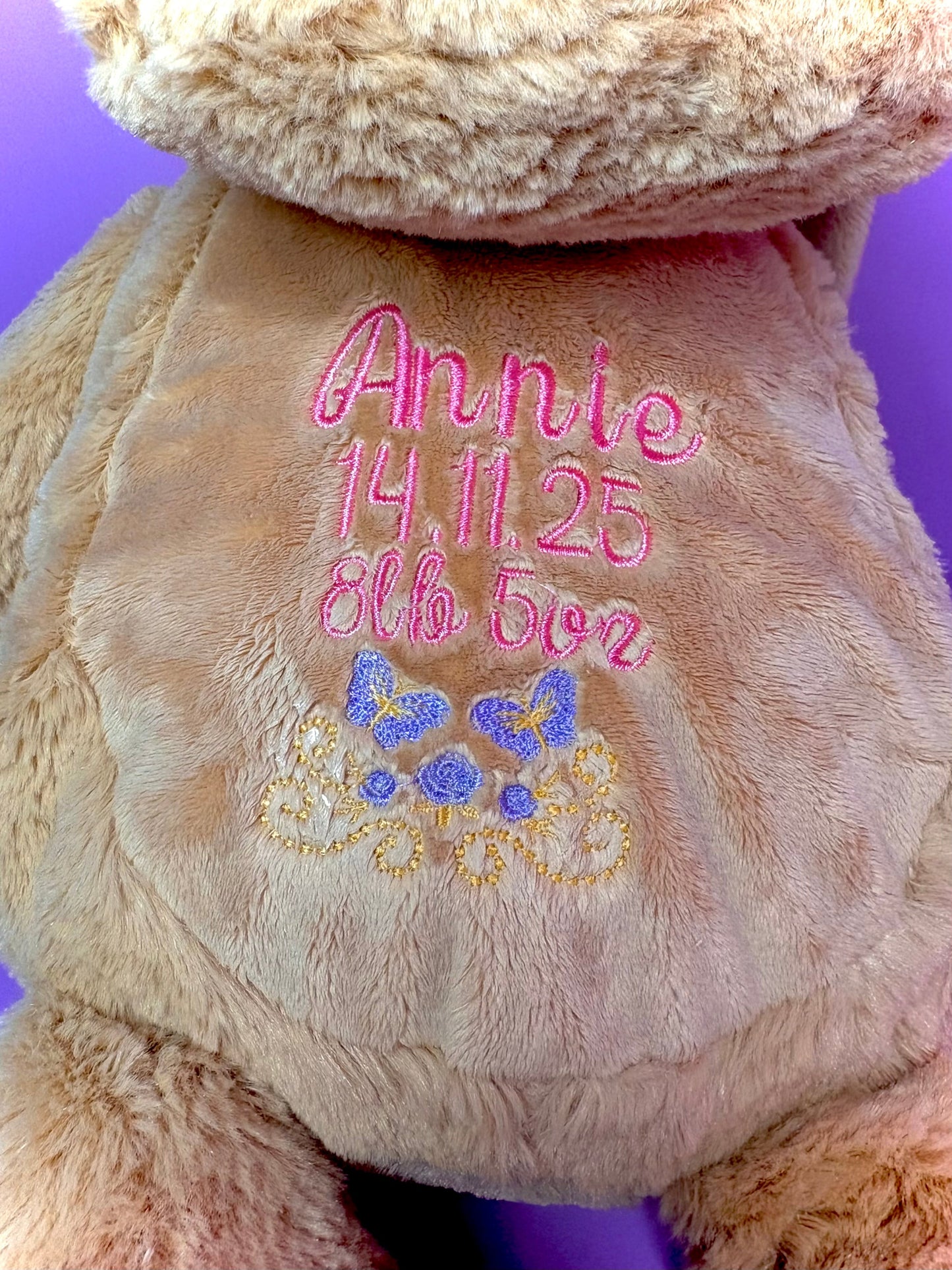 Personalised birth announcement soft toy dog with embroidered baby name, birth date, and weight keepsake for newborns