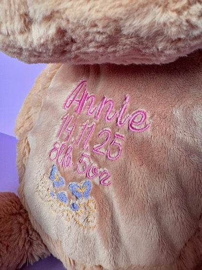 Personalised birth announcement embroidered soft toy dog with baby name and birth details