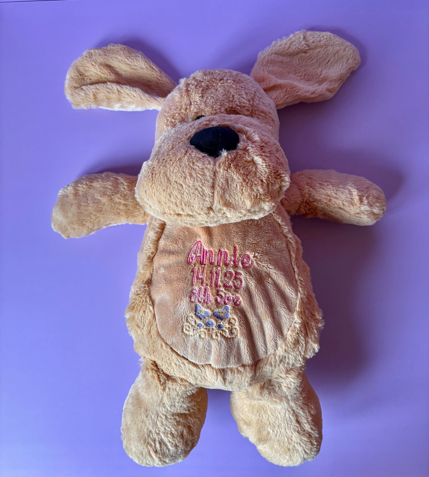 Personalised birth announcement soft toy dog with embroidered baby details