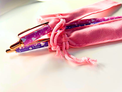 Kawaii Luxe Metal Ballpoint Pens in purple with heart designs, featuring rose gold accents and pink velvet pouches.
