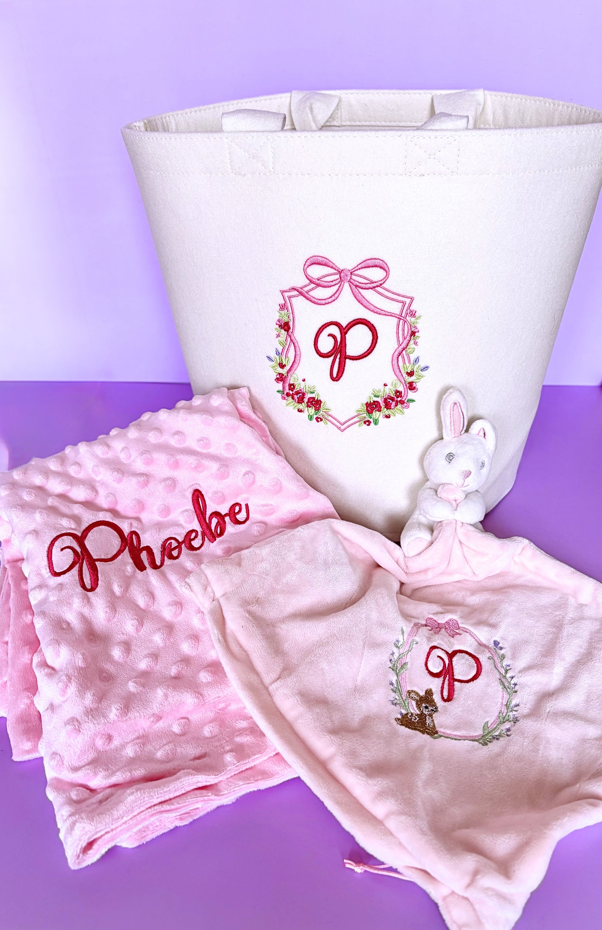 Personalised baby bundle gift set with nursery storage trug, soft minky blanket, and rattling comforter for baby shower gift