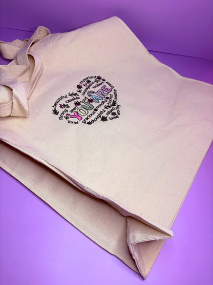 Uplifting Reminder Embroidered Canvas Tote Bag with long handles and gusseted base, durable heavy canvas shopping bag with positive affirmations, ideal birthday gift