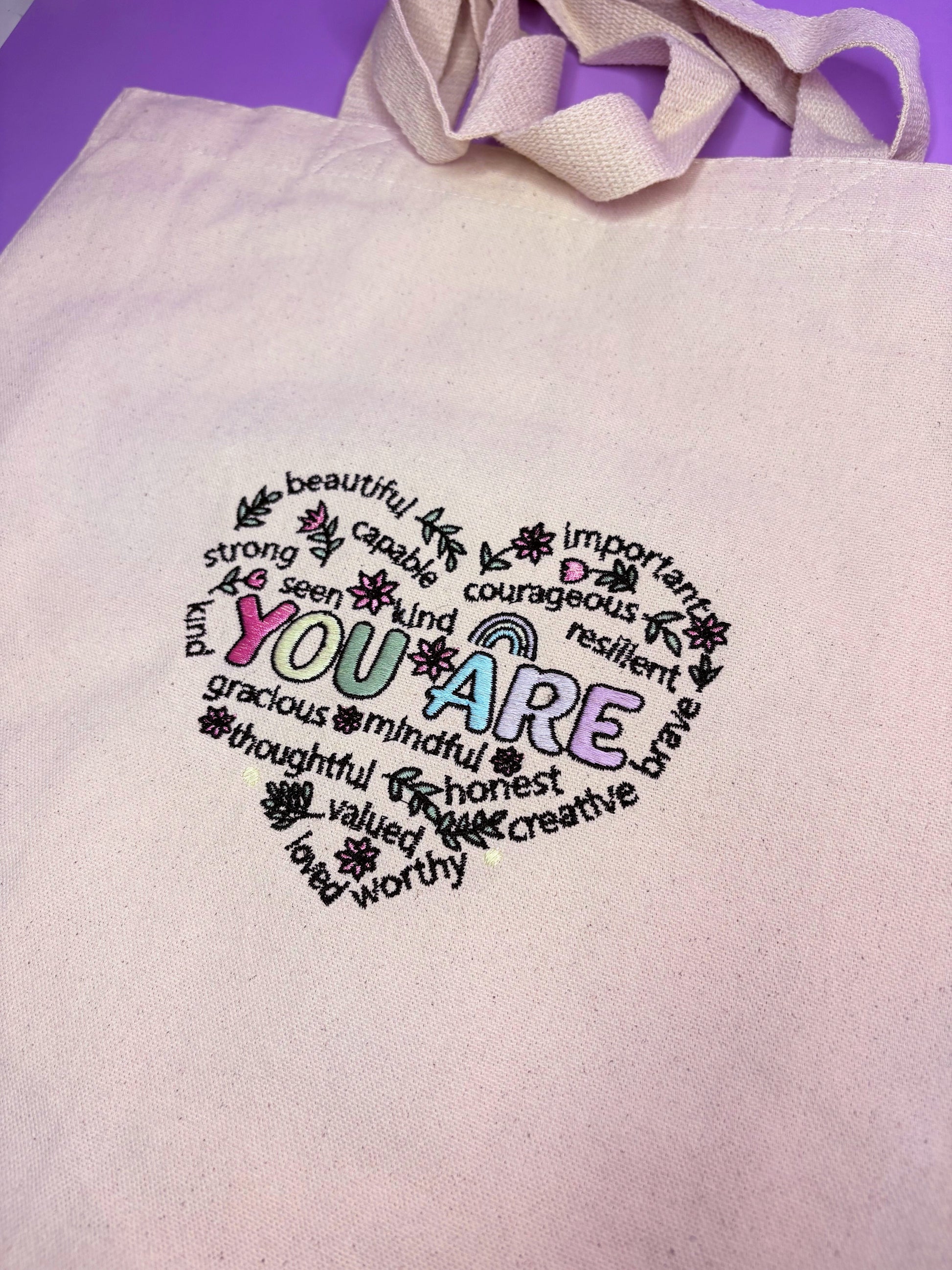 Uplifting reminder embroidered canvas tote bag with long handles and gusseted base for everyday use and gifting