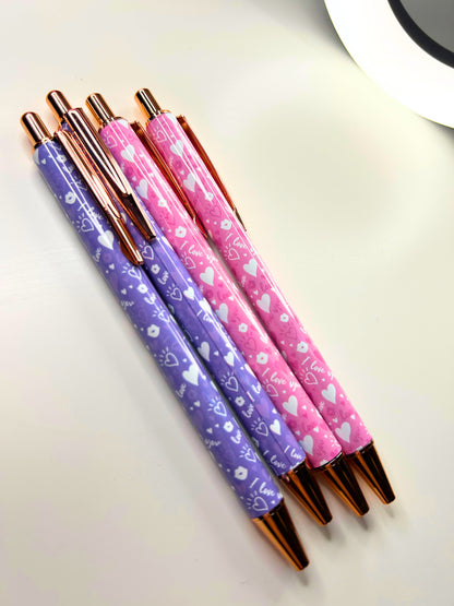 Set of Kawaii Luxe Metal Ballpoint Pens in pink and purple with cute heart and love designs and rose gold accents